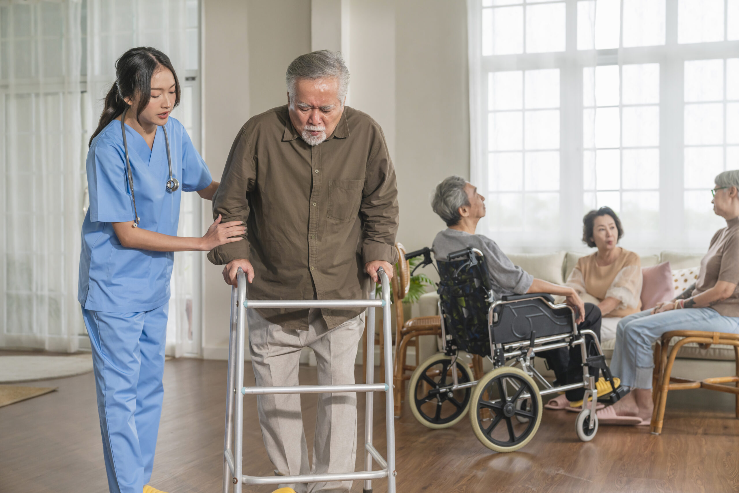 young asian female nurse care giver helping asian senior old man with mobility walker in living area of nursing home senior daycare center,Nurse take care elderly patient with cheerful concentrate